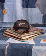 Mini Mel Guitar Black Trucker Hat